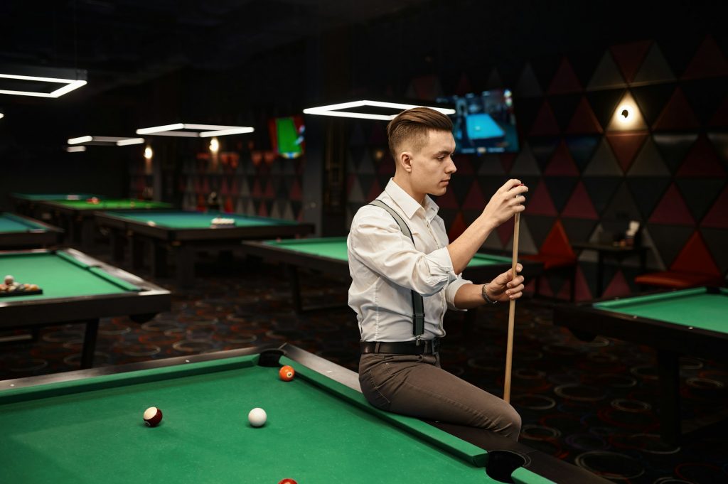 Portrait of stylish young pool player